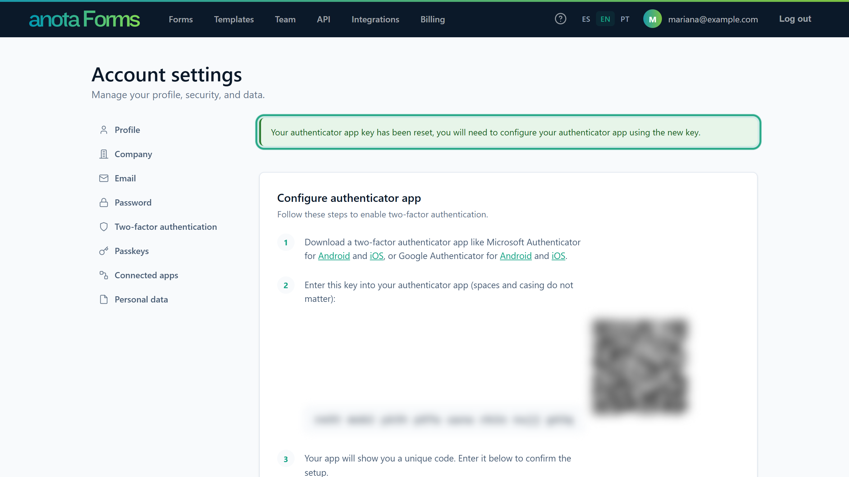 The message Your authenticator app key has been reset, you will need to configure your authenticator app using the new key. outlined, above Configure authenticator app with a new key and QR code (both blurred)