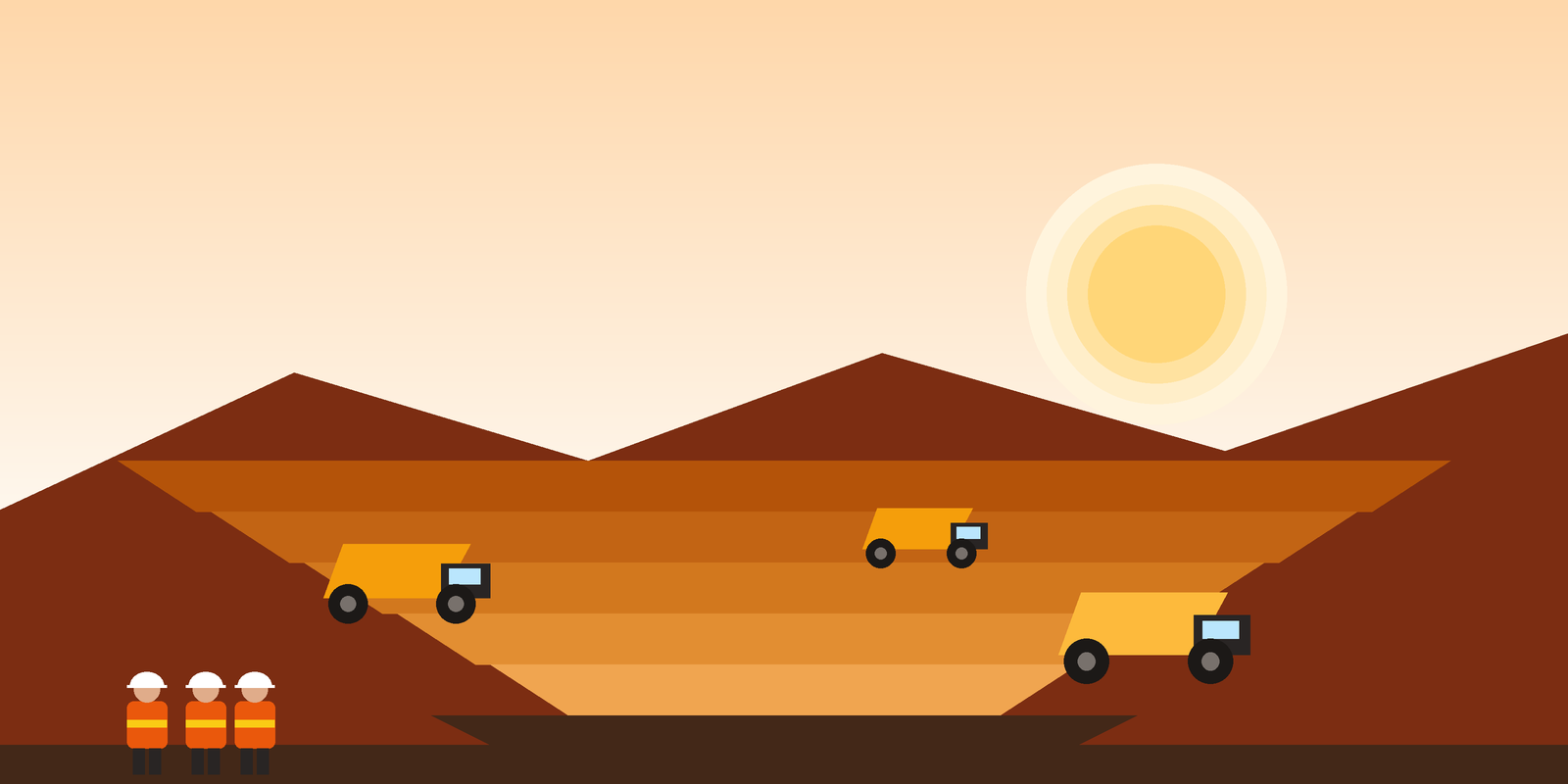 Haul trucks working the benches of the Ridgeline pit at sunrise